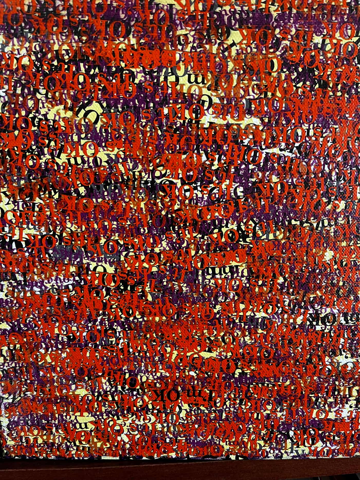 Canvas artwork with repeated versions of “I am OK, you are OK, it’s OK.”